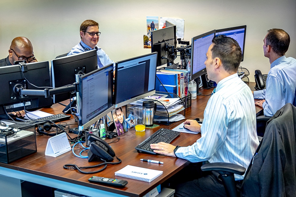 Four workers providing technical IT Support